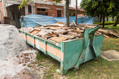 Residents utilizing rubbish removal services in Spitalfields